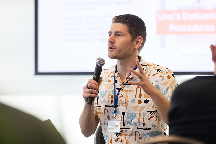 Jared Coleman speaking into microphone